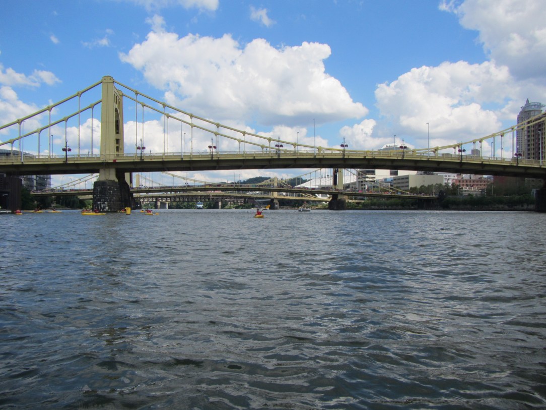 Paddling under one of Pittsburgh's many bridges.